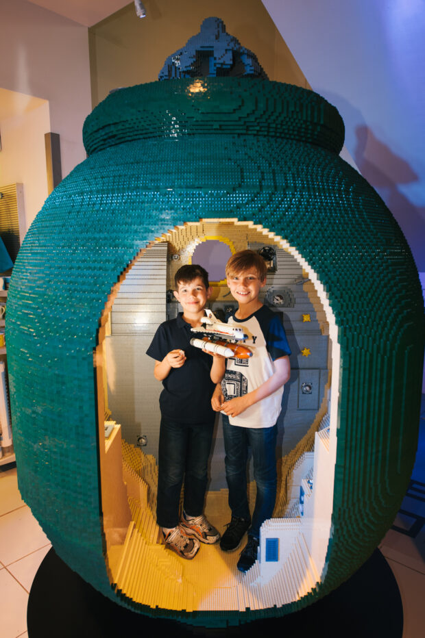 Brothers (l to r) Asten, age 6 and Kye Sciberras, age 8 play in the Lego Soyuz capsule Super-size Lego City Spacecraft lands at The Science Museum. Crafted by a team of LEGO® City Space Master Builders - in association with the UK Space Agency - the Soyuz Capsule build is now in situ at the Science Museum. Modelled on the spacecraft that will deliver British ESA astronaut Tim Peake into space later this year the replica took 650 hours to build using 160,000 LEGO® bricks. Soyuz is a series of spacecraft designed for the Soviet space programme in the 1960s that remains in service today. The LEGO® build is based on the Soyuz Capsule Orbital module that provides accommodation for the crew during their mission. Two thirds the size of the real capsule the detailed design spans 7m by 2.5m and includes a sit in section for young visitors to the attraction. For further information please contact Louise Hathaway or Louise Illes at the Lego press office on 01608 812 830 or louise@nortonandco.com or louiseiles@nortonandco.com PR Handout Copyright: © Mikael Buck / Lego +44 (0) 782 820 1042 http://www.mikaelbuck.com