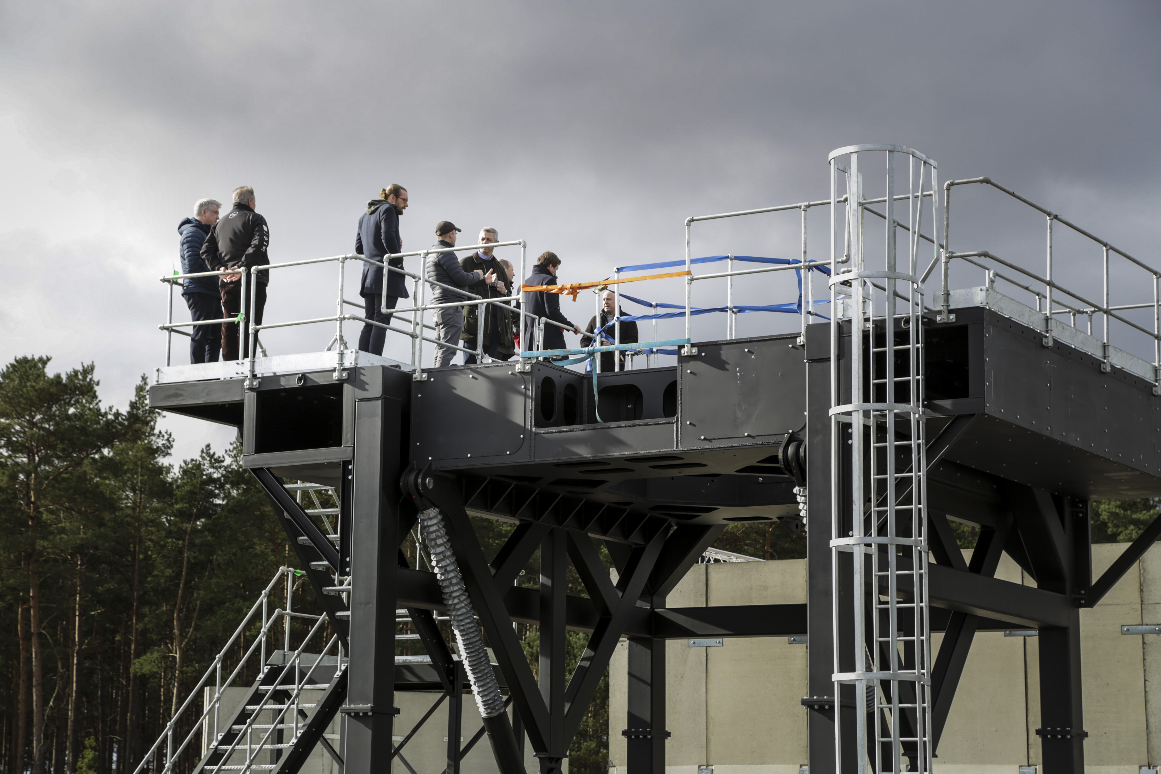 Group of people on metal construction