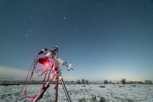 A telescope pointed towards the night sky.