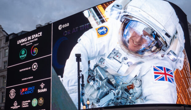 Tim Peake's spacewalk appearing on the Piccadilly Lights as part of World Space Week.